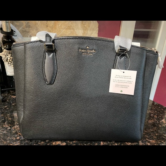 kate spade Handbags - SOLD Brand new with tags,authentic Kate Spade New York Monet leg 3 pocket purse